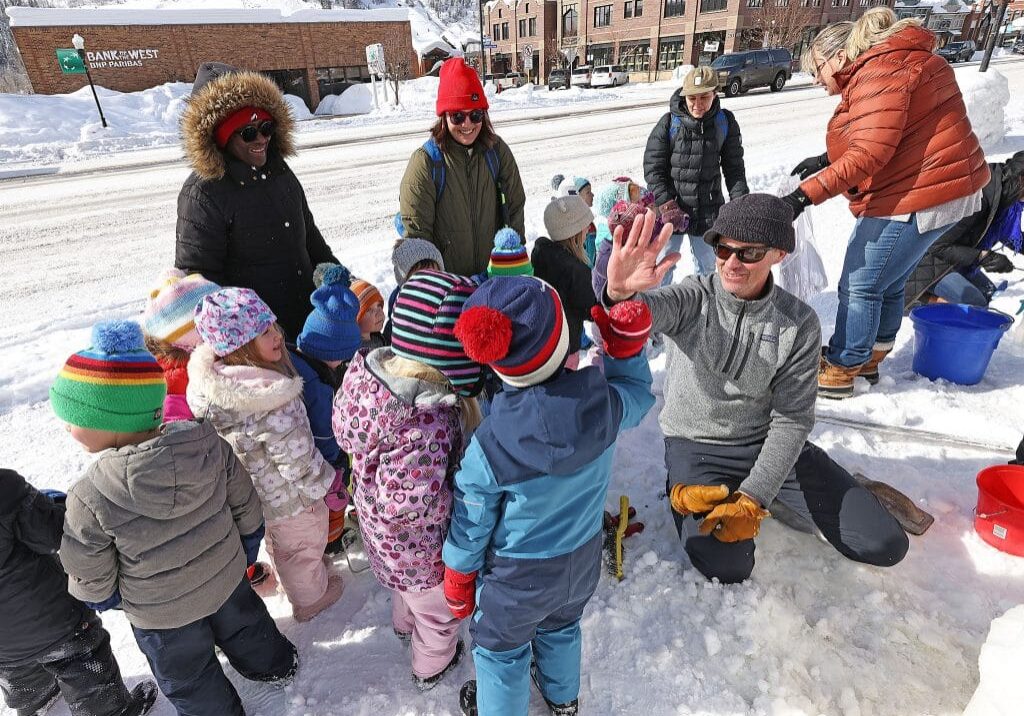 Discovery Learning Center preschool children in downtown Steamboat Springs, CO for winter carnvial snow sculptures.